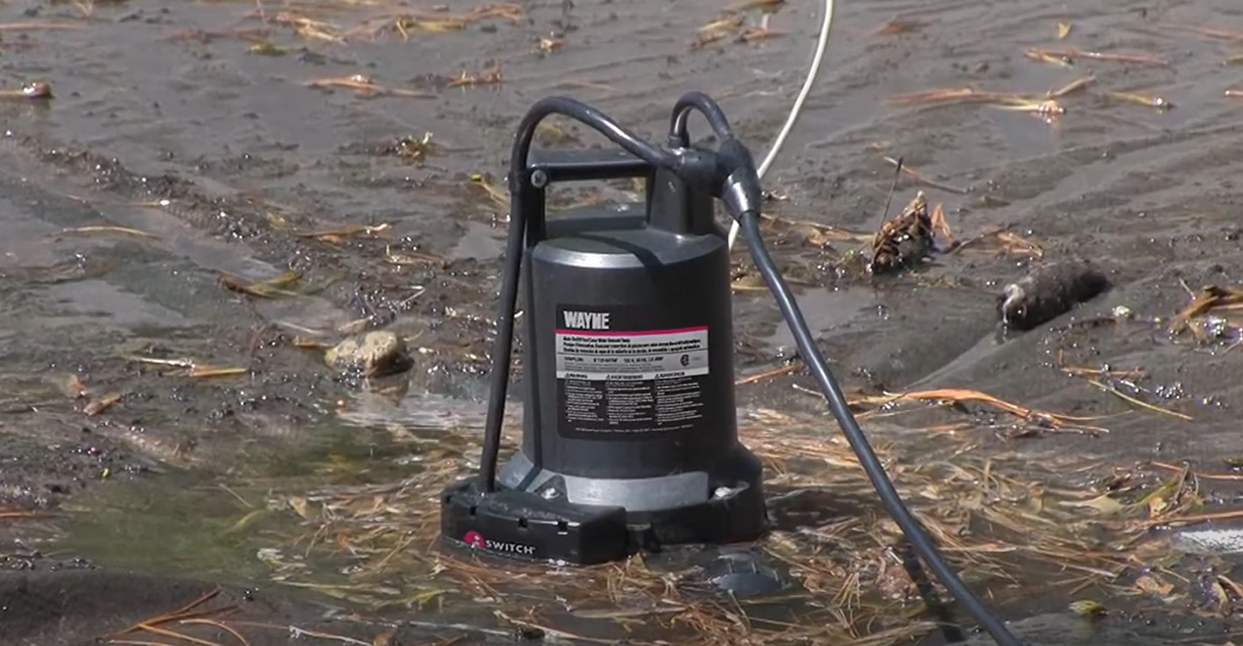 using a pool cover pump to rid water
